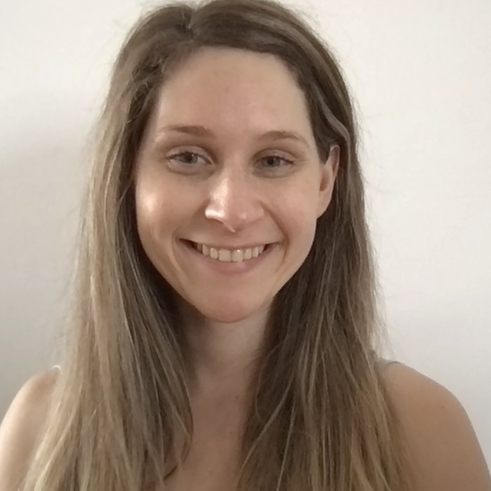 Close, candid portrait of Dr. Kara Larson smiling